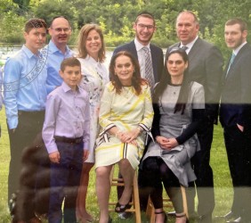 9.	The most recent family photo, June 2019, Bar Mitzvah if Leba’s grandson. Leba sits in yellow dress next to her oldest daughter Jordana. On the right her three grandsons: Amichai, Joseph and Gabriel. Behind Jordana stays Leba’s son-in-law Geoffrey. On the left Leba’s grandsons Noah, Julian and Jonah with their parents: Leba’s son Arim and Erin. 